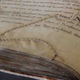 Image for article titled When Medieval Scribes Turned Damaged Paper into Clever Art